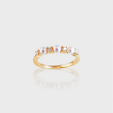 - The Dainty Pearls Moissanite Ring -