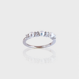 - The Dainty Pearls Moissanite Ring -
